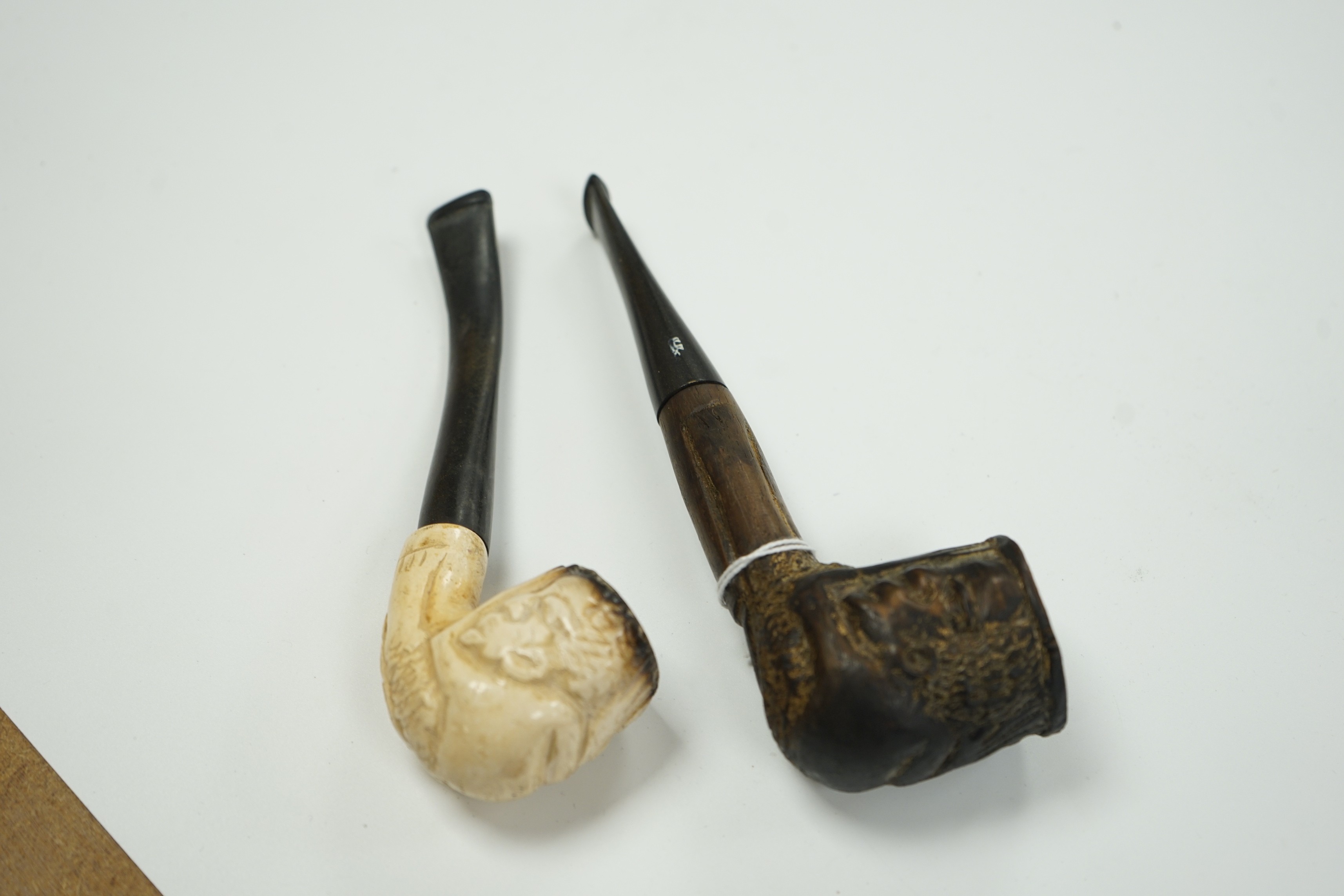 A Meerschaum pipe and an African ebony pipe